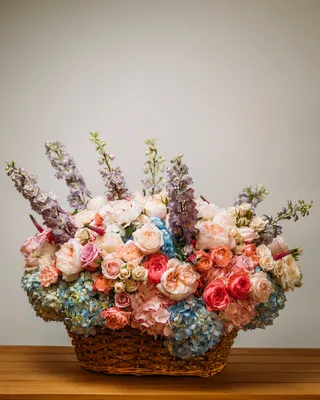 Basket arrangement Enchanting Flower Symphony delivery in Dubai